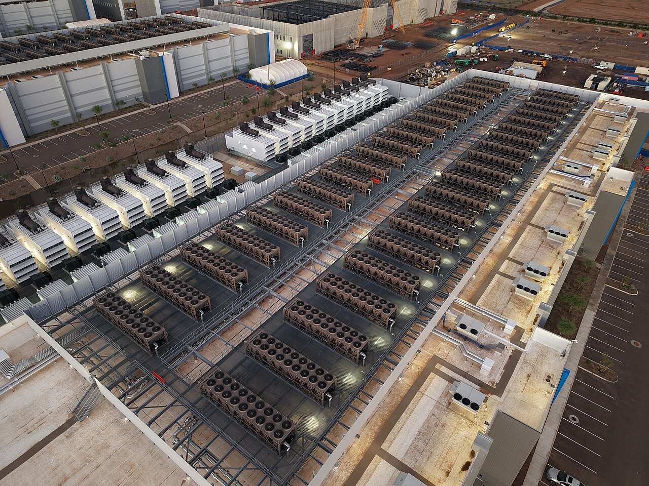 Aerial view of a data center cooling plant with rows of units